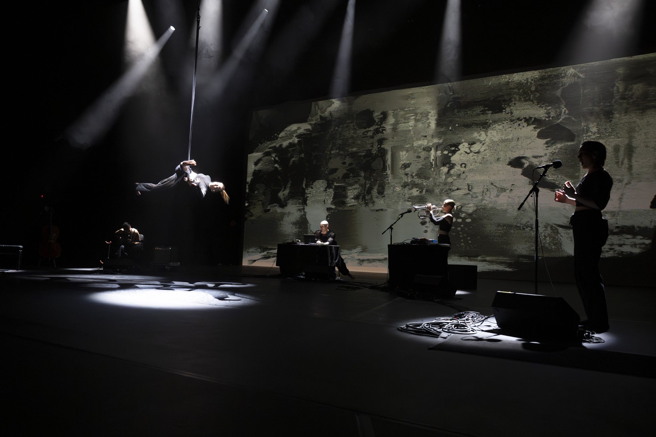 The full stage: aerial, projection, trumpet, voice